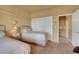 Bedroom with two twin beds and built-in closet at 9833 Villa Ridge Dr, Las Vegas, NV 89134