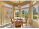 Breakfast nook with large windows and chandelier at 9833 Villa Ridge Dr, Las Vegas, NV 89134