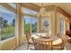 Bright breakfast nook with scenic views from large windows at 9833 Villa Ridge Dr, Las Vegas, NV 89134