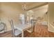 Open concept dining room with hardwood floors and chandelier at 9833 Villa Ridge Dr, Las Vegas, NV 89134