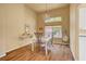 Charming dining room with hardwood floors and a white table at 9833 Villa Ridge Dr, Las Vegas, NV 89134