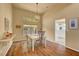 Spacious dining room with hardwood floors and kitchen views at 9833 Villa Ridge Dr, Las Vegas, NV 89134