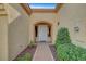 Inviting front entry with a pathway and lush landscaping at 9833 Villa Ridge Dr, Las Vegas, NV 89134