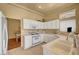 Bright kitchen with white cabinets, gas range, and ample counter space at 9833 Villa Ridge Dr, Las Vegas, NV 89134