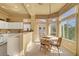 Kitchen features a breakfast nook and white cabinetry at 9833 Villa Ridge Dr, Las Vegas, NV 89134