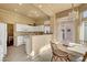 White kitchen with breakfast nook and recessed lighting at 9833 Villa Ridge Dr, Las Vegas, NV 89134