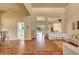 Spacious living room featuring hardwood floors and sectional sofa at 9833 Villa Ridge Dr, Las Vegas, NV 89134