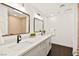 Modern bathroom with double vanity, quartz countertop and hexagon tile floor at 2501 Wimbledon Dr, Las Vegas, NV 89107