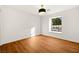 Light-filled bedroom featuring wood floors and a window at 2501 Wimbledon Dr, Las Vegas, NV 89107