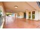 Covered entryway with terracotta flooring and a modern front door at 2501 Wimbledon Dr, Las Vegas, NV 89107