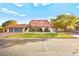 Single-story home with tile roof, arched entryway, and landscaped yard at 2501 Wimbledon Dr, Las Vegas, NV 89107