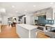 Modern kitchen with an island, stainless steel appliances, and hardwood floors at 2501 Wimbledon Dr, Las Vegas, NV 89107