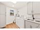 Updated laundry room with gray cabinets at 2501 Wimbledon Dr, Las Vegas, NV 89107