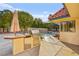 Outdoor kitchen with grill and refrigerator, ideal for summer barbecues at 2501 Wimbledon Dr, Las Vegas, NV 89107