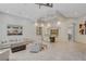 Elegant dining room with a long wooden table and abstract art at 1841 Newport Bay Dr, Las Vegas, NV 89117