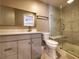 Modern bathroom with gray vanity, quartz countertop, and glass-enclosed shower at 2678 Aracatuba Ave, Las Vegas, NV 89121