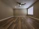 Large bedroom with hardwood floors and ceiling fan at 2678 Aracatuba Ave, Las Vegas, NV 89121