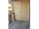 Balcony featuring double doors, a metal railing, and a partial view of the surrounding complex at 5317 Indian River Dr # 295, Las Vegas, NV 89103