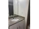 Bathroom vanity with granite countertop, mirror, and cabinets at 5317 Indian River Dr # 295, Las Vegas, NV 89103