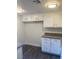 Bright kitchen features white cabinetry, granite countertops, and ample space at 5317 Indian River Dr # 295, Las Vegas, NV 89103