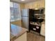 Cozy kitchen equipped with stainless steel appliances and granite countertops at 5317 Indian River Dr # 295, Las Vegas, NV 89103
