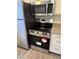 Updated kitchen showcases stainless steel appliances and granite countertops at 5317 Indian River Dr # 295, Las Vegas, NV 89103