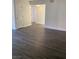 Spacious living room featuring hardwood floors, neutral colored walls, and natural lighting at 5317 Indian River Dr # 295, Las Vegas, NV 89103