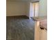 Open living room leads to kitchen area and patio access at 5317 Indian River Dr # 295, Las Vegas, NV 89103