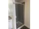 Bathroom featuring a shower with glass doors and tiled walls at 5317 Indian River Dr # 295, Las Vegas, NV 89103