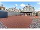 Extensive backyard with gravel, a storage shed, and a covered patio dining area at 2801 Willow Wind Ct, Las Vegas, NV 89117
