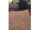Backyard with a storage shed and low-maintenance gravel landscaping at 2801 Willow Wind Ct, Las Vegas, NV 89117