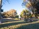 Inviting community park offers grassy area and mature trees, providing a serene setting with pond and wildlife at 2801 Willow Wind Ct, Las Vegas, NV 89117