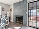 Dining area with fireplace and sliding glass door to backyard at 2801 Willow Wind Ct, Las Vegas, NV 89117