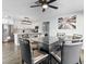 Modern dining area with glass table and leather chairs near kitchen at 2801 Willow Wind Ct, Las Vegas, NV 89117