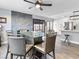 Modern dining area with glass table and leather chairs at 2801 Willow Wind Ct, Las Vegas, NV 89117