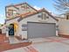 Two-story house with attached garage and Spanish-style architecture at 2801 Willow Wind Ct, Las Vegas, NV 89117