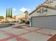 Side view of house showcasing landscaping and garage at 2801 Willow Wind Ct, Las Vegas, NV 89117