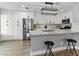 Modern kitchen features white cabinets, stainless steel appliances, and a large island at 2801 Willow Wind Ct, Las Vegas, NV 89117