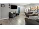 Living room with gray sofas and wood-look floors at 2801 Willow Wind Ct, Las Vegas, NV 89117