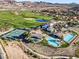 An aerial of the community pool area with golf course, tennis courts and mountain views at 44 Strada Caruso, Henderson, NV 89011