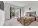 Bright bedroom with sliding glass door to backyard at 44 Strada Caruso, Henderson, NV 89011