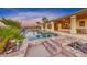 Inviting backyard with a sparkling pool and lush landscaping at 1950 Colvin Run Dr, Henderson, NV 89052