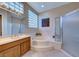 Bathroom featuring a separate shower and tub at 1950 Colvin Run Dr, Henderson, NV 89052