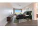 Staged bedroom with modern decor and floor to ceiling view window at 1950 Colvin Run Dr, Henderson, NV 89052