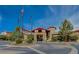 Elegant clubhouse exterior with well-manicured landscaping and prominent flagpoles at 1950 Colvin Run Dr, Henderson, NV 89052