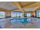 Indoor hot tub with large windows offering scenic views, providing a luxurious and relaxing spa experience at 1950 Colvin Run Dr, Henderson, NV 89052