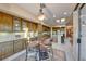 Kitchen with wood cabinets, stone countertops, and a view of the dining area at 1950 Colvin Run Dr, Henderson, NV 89052