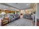 Open concept living room and kitchen with neutral color scheme and fireplace at 1950 Colvin Run Dr, Henderson, NV 89052