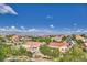 Panoramic view of a well-maintained neighborhood featuring tile roofs, green landscaping, and picturesque scenery at 1950 Colvin Run Dr, Henderson, NV 89052