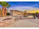 Inviting backyard pool and spa area with lounge chairs and a built-in fire pit feature near the home at 1950 Colvin Run Dr, Henderson, NV 89052